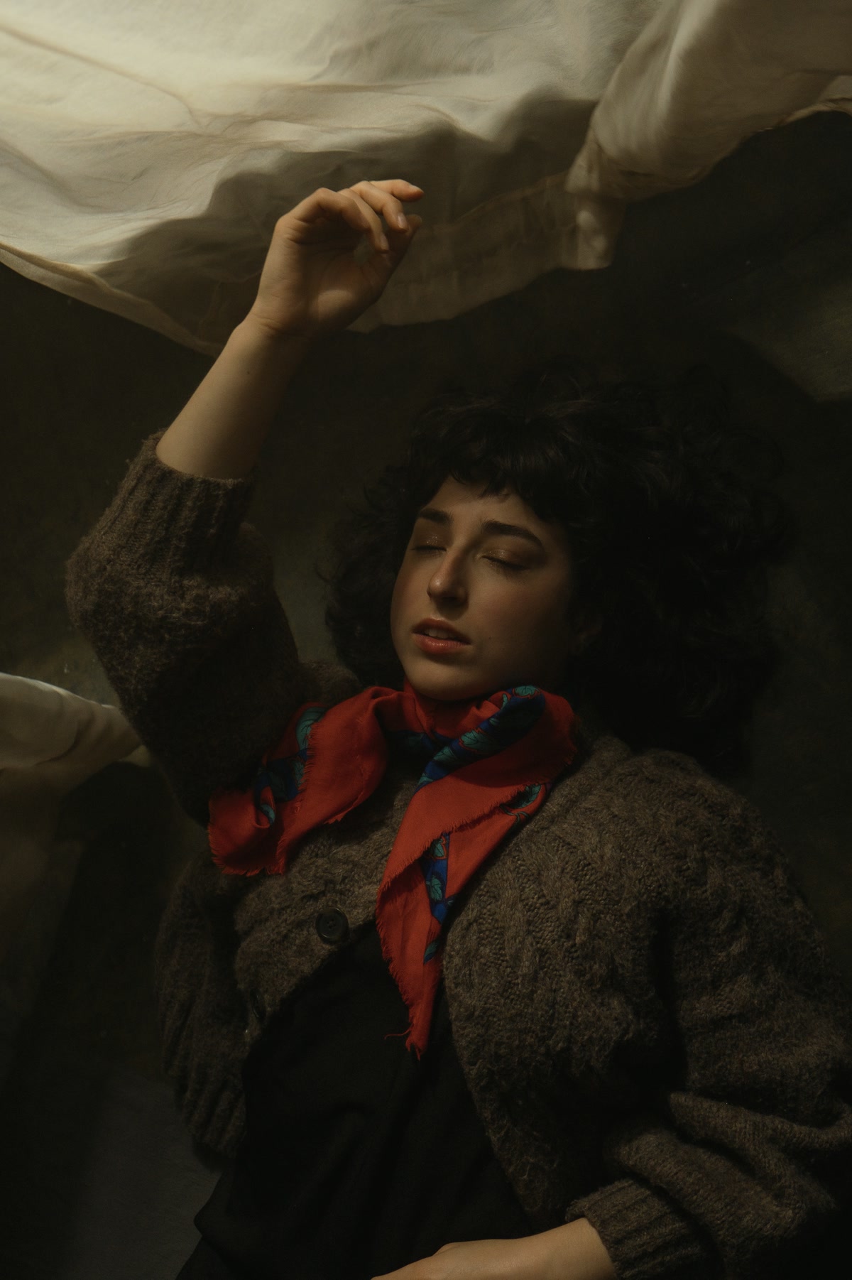 Editorial artistic portrait — warm, cinematic frame, East Village studio NYC